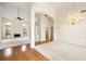 Open-concept living room with fireplace, hardwood floors, and a decorative chandelier at 3753 Honey Pot Ne Way, Marietta, GA 30066