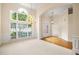 Elegant living room featuring a large window, chandelier, and French doors at 3753 Honey Pot Ne Way, Marietta, GA 30066
