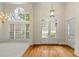 Bright living room showcasing hardwood floors, a large window, and decorative doors at 3753 Honey Pot Ne Way, Marietta, GA 30066