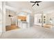 Open-concept room with hardwood floors, white trim, and view of kitchen at 3753 Honey Pot Ne Way, Marietta, GA 30066