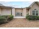 View of the back of the house with a patio and neatly trimmed shrubbery at 3916 Abbott Way # 2, Powder Springs, GA 30127