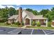 Community clubhouse with brick facade, landscaping, and parking at 3916 Abbott Way # 2, Powder Springs, GA 30127