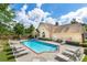 Community swimming pool with ample seating for residents at 3916 Abbott Way # 2, Powder Springs, GA 30127
