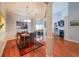 Open floor plan of the dining area with hardwood floors and plenty of natural light at 3916 Abbott Way # 2, Powder Springs, GA 30127