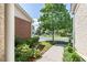 Green front yard with manicured shrubs and a view of the neighborhood street at 3916 Abbott Way # 2, Powder Springs, GA 30127