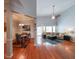 Open-concept living room boasts a vaulted ceiling, hardwood floors and plenty of natural light at 3916 Abbott Way # 2, Powder Springs, GA 30127