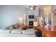 Bright living room with hardwood floors, fireplace with built-ins and an open-concept design at 3916 Abbott Way # 2, Powder Springs, GA 30127