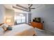 Well-lit main bedroom features tray ceilings, carpeted floors, and a large window at 3916 Abbott Way # 2, Powder Springs, GA 30127