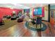 Entertainment basement area with a fireplace, seating area, and a dining table at 3985 Loch Highland Ne Pass, Roswell, GA 30075