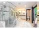 Modern bathroom featuring a glass-enclosed shower, soaking tub, and double vanity sinks at 3985 Loch Highland Ne Pass, Roswell, GA 30075