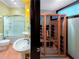 Bright bathroom with a stand-up shower, double sinks, and a modern sauna at 3985 Loch Highland Ne Pass, Roswell, GA 30075