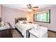 Comfortable bedroom features a neutral color palette, a plush bed, and a side table lamp for relaxing evenings at 3985 Loch Highland Ne Pass, Roswell, GA 30075