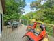 Outdoor deck with seating and lake view at 3985 Loch Highland Ne Pass, Roswell, GA 30075