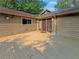 A view of the house entrance from a large deck with wooden flooring at 3985 Loch Highland Ne Pass, Roswell, GA 30075