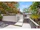 The exterior shows a house with a two-car garage, a wooden deck, and metal railings at 3985 Loch Highland Ne Pass, Roswell, GA 30075
