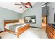 Light-filled main bedroom showcasing a large mirror, vaulted ceiling, and a glimpse into an adjoining room at 3985 Loch Highland Ne Pass, Roswell, GA 30075