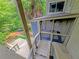 Upper deck with a screened-in porch, and outdoor stairs leading to the grounds at 3985 Loch Highland Ne Pass, Roswell, GA 30075