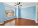 Bright bedroom with hardwood floors and a large window at 577 Reed Se St, Atlanta, GA 30312