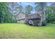 Expansive backyard with lush green lawn and deck perfect for outdoor enjoyment at 2140 Deer Trl, Suwanee, GA 30024