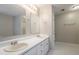 Bright bathroom features double sinks, large mirrors, and ample countertop space at 2140 Deer Trl, Suwanee, GA 30024