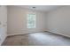 This cozy bedroom has a closet and a large window at 2140 Deer Trl, Suwanee, GA 30024