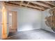 Bedroom under repair with exposed structure and open door at 2140 Deer Trl, Suwanee, GA 30024