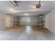 Large garage space featuring storage shelving and concrete floor at 2140 Deer Trl, Suwanee, GA 30024