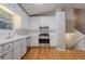 Clean kitchen featuring white cabinets, stainless steel appliances, and hardwood floors at 2140 Deer Trl, Suwanee, GA 30024