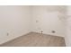 Laundry room with laminate flooring and shelving at 2140 Deer Trl, Suwanee, GA 30024