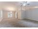 Spacious living room boasts high ceilings, recessed lights, ceiling fan, and access to outdoor space at 2140 Deer Trl, Suwanee, GA 30024