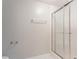 Bathroom shower featuring a glass door and towel bar at 2140 Deer Trl, Suwanee, GA 30024