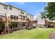Townhome exteriors and decks are surrounded by a well-maintained green lawn, perfect for outdoor enjoyment at 3655 Chattahoochee Summit Se Dr # 16, Atlanta, GA 30339