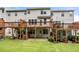 Townhome exteriors and decks are surrounded by a well-maintained green lawn, perfect for outdoor enjoyment at 3655 Chattahoochee Summit Se Dr # 16, Atlanta, GA 30339