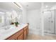 Bright bathroom with a double vanity, large mirror, separate tub, and glass-enclosed shower at 3655 Chattahoochee Summit Se Dr # 16, Atlanta, GA 30339