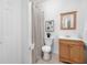 Well-maintained bathroom features a vanity with a wooden cabinet and a shower with a curtain at 3655 Chattahoochee Summit Se Dr # 16, Atlanta, GA 30339