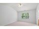 Bright bedroom with a ceiling fan and large window that brings in natural light at 3655 Chattahoochee Summit Se Dr # 16, Atlanta, GA 30339