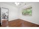 Bright bedroom featuring hardwood floors and a sunlit window, creating a warm atmosphere at 3655 Chattahoochee Summit Se Dr # 16, Atlanta, GA 30339