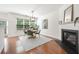 Dining area featuring a modern chandelier, fireplace, and views of the backyard at 3655 Chattahoochee Summit Se Dr # 16, Atlanta, GA 30339