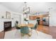 Open dining area with fireplace, kitchen view, modern lighting, and stainless appliances at 3655 Chattahoochee Summit Se Dr # 16, Atlanta, GA 30339