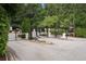 Gated community entrance with mature landscaping and security features for residents' peace of mind at 3655 Chattahoochee Summit Se Dr # 16, Atlanta, GA 30339