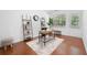 Bright home office with hardwood floors, modern shelving, and a large window at 3655 Chattahoochee Summit Se Dr # 16, Atlanta, GA 30339