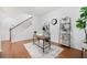 Stylish home office featuring a modern desk, decor, wood floors, and a staircase at 3655 Chattahoochee Summit Se Dr # 16, Atlanta, GA 30339