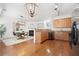 Modern kitchen and dining area featuring a fireplace, open floor plan, and granite countertops at 3655 Chattahoochee Summit Se Dr # 16, Atlanta, GA 30339