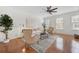 Spacious living room with hardwood floors, fan, and abundant natural light at 3655 Chattahoochee Summit Se Dr # 16, Atlanta, GA 30339