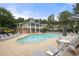Community pool area with comfortable lounge chairs, tables and umbrellas for relaxing by the pool at 3655 Chattahoochee Summit Se Dr # 16, Atlanta, GA 30339