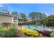 Community pool area with lounge chairs and manicured landscaping around the pool at 3655 Chattahoochee Summit Se Dr # 16, Atlanta, GA 30339