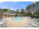 Outdoor community pool area with lounge chairs and clubhouse, perfect for relaxation at 3655 Chattahoochee Summit Se Dr # 16, Atlanta, GA 30339