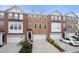 Brick townhomes with attached garages, manicured landscaping and ample parking spaces at 3655 Chattahoochee Summit Se Dr # 16, Atlanta, GA 30339