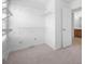 Walk-in closet with carpet and white wire shelving, providing ample storage space at 3655 Chattahoochee Summit Se Dr # 16, Atlanta, GA 30339