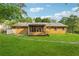 Well-maintained backyard with a home featuring a screened-in porch at 3690 Basswood Rd, Snellville, GA 30039